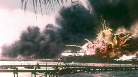 A colorized photo shows the moment the Mahan-class destroyer, USS Shaw (DD-373) exploded after bring attacked by Japanese dive bombers. The bombs detonated in her forward ammunition magazine, causing the explosion. Remarkably, Shaw was repaired and returned to service, earning 11 battle stars during the war. Image of A colorized photo shows the moment the Mahan-class destroyer, USS Shaw (DD-373) exploded after bring attacked by Japanese dive bombers. The bombs detonated in her forward ammunition magazine, causing the explosion. Remarkably, Shaw was repaired and returned to service, earning 11 battle stars during the war.