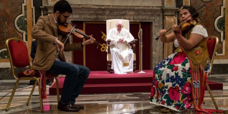 Indigenous musicians play for Pope Francis. The Holy Father is going to Canada to offer an apology for Church behavior towards the Indigenous people. Image of Indigenous musicians play for Pope Francis. The Holy Father is going to Canada to offer an apology for Church behavior towards the Indigenous people.