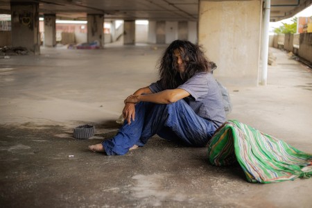 Upset homeless teenager wearing hoodie, feeling cold, indifference and poverty. Upset homeless teenager wearing hoodie, feeling cold, indifference and poverty.