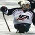 PARALYMPIAN COMPETES – Chris Manns, a member of the U.S. Paralympics sled hockey team, is pictured during a game in early February against Germany in the USA Cup in Colorado Springs, Colo. Manns, 25, was named to his second sled hockey team, which was competing in this year's Paralympic Games March 10-19 in Turin, Italy. (Colorado Catholic Herald photo) Image of PARALYMPIAN COMPETES – Chris Manns, a member of the U.S. Paralympics sled hockey team, is pictured during a game in early February against Germany in the USA Cup in Colorado Springs, Colo. Manns, 25, was named to his second sled hockey team, which was competing in this year's Paralympic Games March 10-19 in Turin, Italy. (Colorado Catholic Herald photo)