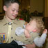 PHILADELPHIA TEEN HOLDS BABY BROTHER SEVERAL MONTHS AFTER SAVING HIS LIFE
Joseph McCabe cradles his brother Riley, now 18 months old, after Riley fell asleep at St. Cecilia Church in Philadelphia. Joseph will always remember July 20, 2005, as the day he saved the life of Riley, then 9 months old. The 13-year-old Boy Scout per formed the Heimlich maneuver on the infant after he swallowed a piece of tape and began choking. (CNS/Catholic Standard & Times) Image of PHILADELPHIA TEEN HOLDS BABY BROTHER SEVERAL MONTHS AFTER SAVING HIS LIFE
Joseph McCabe cradles his brother Riley, now 18 months old, after Riley fell asleep at St. Cecilia Church in Philadelphia. Joseph will always remember July 20, 2005, as the day he saved the life of Riley, then 9 months old. The 13-year-old Boy Scout per formed the Heimlich maneuver on the infant after he swallowed a piece of tape and began choking. (CNS/Catholic Standard & Times)