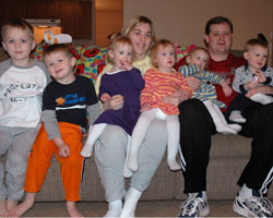 INDIANAPOLIS COUPLE AT HOME WITH QUADRUPLETS PLUS TWO
Rick and Ellen Taylor of Indianapolis pose for a photo with their 2-year-old quadruplets and two older sons. The children from left are Zachary, 7; Jacob, 4; Allison, Hannah, Abigail and Benjamin. Ellen teaches a first-grade class at Holy Name School in Beech Grove, Ind. (CNS/The Criterion)
Image of INDIANAPOLIS COUPLE AT HOME WITH QUADRUPLETS PLUS TWO
Rick and Ellen Taylor of Indianapolis pose for a photo with their 2-year-old quadruplets and two older sons. The children from left are Zachary, 7; Jacob, 4; Allison, Hannah, Abigail and Benjamin. Ellen teaches a first-grade class at Holy Name School in Beech Grove, Ind. (CNS/The Criterion)