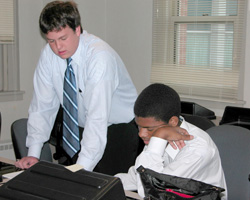 STUDENTS PREPARE TO PRESENT BUSINESS PLAN – Aspiring entrepreneurs Joseph Heck, left, and Jamal Calhoon prepare to present their plan to a panel of judges at a summer program at St. Louis University (SLU) for high-school students interested in starting a business. The program, sponsored by the Smurfit-Stone Center for Entrepreneurship at the university's business school, was called Image of STUDENTS PREPARE TO PRESENT BUSINESS PLAN – Aspiring entrepreneurs Joseph Heck, left, and Jamal Calhoon prepare to present their plan to a panel of judges at a summer program at St. Louis University (SLU) for high-school students interested in starting a business. The program, sponsored by the Smurfit-Stone Center for Entrepreneurship at the university's business school, was called