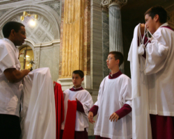 VATICAN ALTAR BOYS ASSIST PRIEST BEFORE EARLY MORNING MASS - Vatican altar boys assist a priest before the celebration of the first morning Mass in St. Peter's Basilica Aug. 8. (CNS/Catholic Press Photo) Image of VATICAN ALTAR BOYS ASSIST PRIEST BEFORE EARLY MORNING MASS - Vatican altar boys assist a priest before the celebration of the first morning Mass in St. Peter's Basilica Aug. 8. (CNS/Catholic Press Photo)