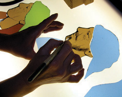 STAINED-GLASS ARTIST WORKS IN VERMONT STUDIO - Stained-glass artist Debora Coombs adds shading to a figure in one of her works in her Readsboro, Vt., studio. The British-born artist works in the studio that's about 20 feet by 30 feet, a former garage her husband converted for her work after they moved to this rural area about 10 years ago. Stained-glass windows, she says, are Image of STAINED-GLASS ARTIST WORKS IN VERMONT STUDIO - Stained-glass artist Debora Coombs adds shading to a figure in one of her works in her Readsboro, Vt., studio. The British-born artist works in the studio that's about 20 feet by 30 feet, a former garage her husband converted for her work after they moved to this rural area about 10 years ago. Stained-glass windows, she says, are