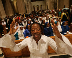 WOMAN SINGS DURING AFRICAN CELEBRATION AT WASHINGTON SHRINE: Julian Kiganda sings as she participates in a liturgical dance at a Mass during the first African National Eucharistic Congress at the Basilica of the National Shrine of the Immaculate Conception in Washington Sept. 2. Bishop Augustine Shao of Zanzibar, Tanzania, was the celebrant. (CNS photo/Paul Haring)
Image of WOMAN SINGS DURING AFRICAN CELEBRATION AT WASHINGTON SHRINE: Julian Kiganda sings as she participates in a liturgical dance at a Mass during the first African National Eucharistic Congress at the Basilica of the National Shrine of the Immaculate Conception in Washington Sept. 2. Bishop Augustine Shao of Zanzibar, Tanzania, was the celebrant. (CNS photo/Paul Haring)