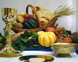 THANKSGIVING GRACE – The foods of the secular Thanksgiving feast are pictured with the spiritual food of the Eucharist – the word in Greek means gratitude or thankfulness. The prayer before the meal at the Thanksgiving Day can be a time of reflection and gratitude for those assembled around the dining room table.(CNS/courtesy Southern Nebraska Register) Image of THANKSGIVING GRACE – The foods of the secular Thanksgiving feast are pictured with the spiritual food of the Eucharist – the word in Greek means gratitude or thankfulness. The prayer before the meal at the Thanksgiving Day can be a time of reflection and gratitude for those assembled around the dining room table.(CNS/courtesy Southern Nebraska Register)