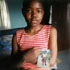 THE CHILDREN LEFT BEHIND: Sizakele Keswa, 13, South Africa, holds the only picture of her deceased mother. This photograph is a part of a multimedia exhibit featuring creative works that capture life though the eyes of orphans and other children left vulnerable by HIV/AIDS. A glimpse of the exhibit and tour schedule can be found at
<a href=http://www.the children left behind.org/index.cfm target=_blank>www.thechildrenleft behind.org/index.cfm</a>
(Photo/CRS)
Image of THE CHILDREN LEFT BEHIND: Sizakele Keswa, 13, South Africa, holds the only picture of her deceased mother. This photograph is a part of a multimedia exhibit featuring creative works that capture life though the eyes of orphans and other children left vulnerable by HIV/AIDS. A glimpse of the exhibit and tour schedule can be found at
<a href=http://www.the children left behind.org/index.cfm target=_blank>www.thechildrenleft behind.org/index.cfm</a>
(Photo/CRS)