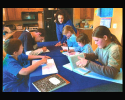 THERE'S NO PLACE LIKE HOME: Sue O'Hanlon (standing) teaches her children at home in Clayton, Del. Attending class (clock-wise from bottom left) are David, Drew, Mary Beth, Teresa and Skylar. O'Hanlon calls her 12-year experience in home schooling Image of THERE'S NO PLACE LIKE HOME: Sue O'Hanlon (standing) teaches her children at home in Clayton, Del. Attending class (clock-wise from bottom left) are David, Drew, Mary Beth, Teresa and Skylar. O'Hanlon calls her 12-year experience in home schooling