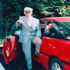 CENTENARIAN POSES IN FRONT OF CAR IN CONNECTICUT PARISH PARKING LOT - Mike Mele, who celebrated his 100th birthday Dec. 16, poses by his sporty, candy-apple-red Ford Probe in the parking lot of his parish, Our Lady of Mount Carmel in Hamden, Conn. Mele is a catechist, lector, altar server and extraordinary minister of holy Communion at his church. (CNS photo/Mary Chalupsky, Catholic Transcript) Image of CENTENARIAN POSES IN FRONT OF CAR IN CONNECTICUT PARISH PARKING LOT - Mike Mele, who celebrated his 100th birthday Dec. 16, poses by his sporty, candy-apple-red Ford Probe in the parking lot of his parish, Our Lady of Mount Carmel in Hamden, Conn. Mele is a catechist, lector, altar server and extraordinary minister of holy Communion at his church. (CNS photo/Mary Chalupsky, Catholic Transcript)