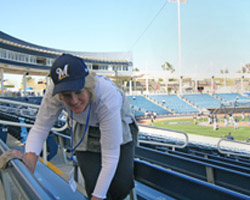 SPRING TRAINING FUND RAISER - Reene Bertone cleans the bleachers March 1 at Maryvale Stadium where the Milwaukee Brewers hold spring training. She staffs the games with dozens of volunteers to raise money for St. Vincent de Paul Parish. (The Catholic Sun)
Image of SPRING TRAINING FUND RAISER - Reene Bertone cleans the bleachers March 1 at Maryvale Stadium where the Milwaukee Brewers hold spring training. She staffs the games with dozens of volunteers to raise money for St. Vincent de Paul Parish. (The Catholic Sun)