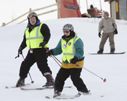 PRIEST GUIDES BLIND SKIER DOWN HILL – Father Bill Key, pastor of St. Joseph Parish in Waukesha, Wis., guides Doreen Lundgren down Sunburst Ski Hill in Kewaskum, Wis., Feb. 18. Father Key has been a guide for the Lions Club Blind Outdoor Leisure Development for 20 years. (CNS/Catholic Herald) Image of PRIEST GUIDES BLIND SKIER DOWN HILL – Father Bill Key, pastor of St. Joseph Parish in Waukesha, Wis., guides Doreen Lundgren down Sunburst Ski Hill in Kewaskum, Wis., Feb. 18. Father Key has been a guide for the Lions Club Blind Outdoor Leisure Development for 20 years. (CNS/Catholic Herald)