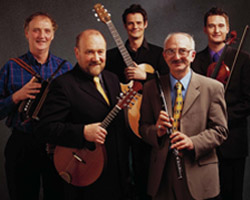 MEMBERS OF MUSIC BAND BOYS OF THE LOUGH – Brenden Begley, Dave Richardson, Malcom Stitt, Cathal McConnell (with glasses) and Kevin Henderson are members of the Celtic music band Boys of the Lough. Even after playing professionally for 40 years, Catholic member Cathal McConnell, a flutist and vocalist for the band, finds there are some songs that are too sensitive to make the group's repertoire, namely those about religion and politics. (CNS/courtesy of Boys of the Lough) Image of MEMBERS OF MUSIC BAND BOYS OF THE LOUGH – Brenden Begley, Dave Richardson, Malcom Stitt, Cathal McConnell (with glasses) and Kevin Henderson are members of the Celtic music band Boys of the Lough. Even after playing professionally for 40 years, Catholic member Cathal McConnell, a flutist and vocalist for the band, finds there are some songs that are too sensitive to make the group's repertoire, namely those about religion and politics. (CNS/courtesy of Boys of the Lough)