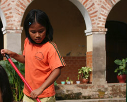 GIRL SWEEPS COURTYARD OF MISSION FOR CHILDREN IN PERU
A girl sweeps the courtyard of a mission for children in Puerto Ocopa, Peru, Feb. 13. Five Franciscan sisters care for nearly 100 children at the mission. Children arrive at the mission under different circumstances. Some come when they are newborns, wh ile others are left at the mission because their families don't have enough food. (CNS photo/Barbara Fraser) Image of GIRL SWEEPS COURTYARD OF MISSION FOR CHILDREN IN PERU
A girl sweeps the courtyard of a mission for children in Puerto Ocopa, Peru, Feb. 13. Five Franciscan sisters care for nearly 100 children at the mission. Children arrive at the mission under different circumstances. Some come when they are newborns, wh ile others are left at the mission because their families don't have enough food. (CNS photo/Barbara Fraser)