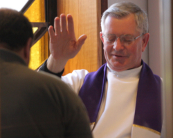 PRIEST ADMINISTERS ABSOLUTION – Msgr. Francis Midura administers absolution to a man at St. Thomas More Church in Hauppauge, N.Y., April 2 during the annual Day of Reconciliation in the Diocese of Rockville Centre, N.Y. Catholics preparing to meet their “Easter duty” to receive communion during the Easter season are also required to do a moral inventory, said author Mary Carty. (CNS/Long Island Catholic)
Image of PRIEST ADMINISTERS ABSOLUTION – Msgr. Francis Midura administers absolution to a man at St. Thomas More Church in Hauppauge, N.Y., April 2 during the annual Day of Reconciliation in the Diocese of Rockville Centre, N.Y. Catholics preparing to meet their “Easter duty” to receive communion during the Easter season are also required to do a moral inventory, said author Mary Carty. (CNS/Long Island Catholic)