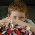 THIRD-GRADER POSES WITH BLANKETS FOR CHARITIES PROGRAM – Connor McClain, who enlisted the third-graders at Good Shepherd School in Shawnee, Kan., to make baby blankets for a hospice program and for Catholic Charities' mother-baby program, poses with some of the blankets in mid-April. (CNS/The Leaven) Image of THIRD-GRADER POSES WITH BLANKETS FOR CHARITIES PROGRAM – Connor McClain, who enlisted the third-graders at Good Shepherd School in Shawnee, Kan., to make baby blankets for a hospice program and for Catholic Charities' mother-baby program, poses with some of the blankets in mid-April. (CNS/The Leaven)