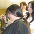 MOUNT ST. MARY'S ACADEMY STUDENTS VOLUNTEER DONATE HAIR -Stylist Catherine Carraway hands Adrian Clark, a freshman at Mount St. Mary Academy in Little Rock, Ark., an eight-inch ponytail just cut from her hair, as Adrian’s mother Susan Clark awaits her turn. (Arkansas Catholic/Tara Little) Image of MOUNT ST. MARY'S ACADEMY STUDENTS VOLUNTEER DONATE HAIR -Stylist Catherine Carraway hands Adrian Clark, a freshman at Mount St. Mary Academy in Little Rock, Ark., an eight-inch ponytail just cut from her hair, as Adrian’s mother Susan Clark awaits her turn. (Arkansas Catholic/Tara Little)