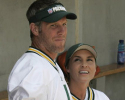 GREAT QB, GREAT WIFE - Brett and Deanna Favre stand in the dugout at their charity softball game. Image of GREAT QB, GREAT WIFE - Brett and Deanna Favre stand in the dugout at their charity softball game.