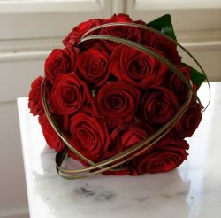 ROSES ARE RED – Roses are a traditional gift indicating love and romance any day of the year but particularly on Valentine's Day. The late medieval custom of exchanging love notes on St. Valentine's Day has little to do with saints and is thought to have developed from the belief that the day marked the start of the mating season of birds. Author Mary Carty says woe to those who fail to make the time observe Valentine’s Day as a special opportunity to show one’s spouse a token of love. (www.freedigitalphotos.net) Image of ROSES ARE RED – Roses are a traditional gift indicating love and romance any day of the year but particularly on Valentine's Day. The late medieval custom of exchanging love notes on St. Valentine's Day has little to do with saints and is thought to have developed from the belief that the day marked the start of the mating season of birds. Author Mary Carty says woe to those who fail to make the time observe Valentine’s Day as a special opportunity to show one’s spouse a token of love. (www.freedigitalphotos.net)