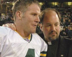 TOP TEN - Brett Favre, quarterback of the Green Bay Packers, exits the field with the team chaplain, Norbertine Father James T. Baraniak, after the Packers' 41-7 victory over the Raiders in Oakland, Calif., Dec. 22. Favre is one of Catholic Online's Top Ten Catholic Heroes of the Super Bowl. (CNS photo by Jim Biever, Green Bay Packers) Image of TOP TEN - Brett Favre, quarterback of the Green Bay Packers, exits the field with the team chaplain, Norbertine Father James T. Baraniak, after the Packers' 41-7 victory over the Raiders in Oakland, Calif., Dec. 22. Favre is one of Catholic Online's Top Ten Catholic Heroes of the Super Bowl. (CNS photo by Jim Biever, Green Bay Packers)