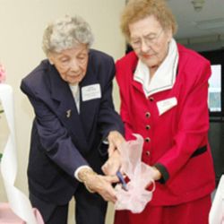 REDEDICATION - Lena Whitaker and Mary Schaffer, residents of The Villas in Southgate, cut the ceremonial ribbon at the rededication of the renovated complex in Colorado Springs on Jan. 31. (Herald/Jim Myers) Image of REDEDICATION - Lena Whitaker and Mary Schaffer, residents of The Villas in Southgate, cut the ceremonial ribbon at the rededication of the renovated complex in Colorado Springs on Jan. 31. (Herald/Jim Myers)