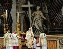 Pope Benedict XVI holds a candle as he celebrates an Easter Vigil mass in Saint Peter's Basilica at the Vatican March 22, 2008.He is accompanied by a Deacon. Image of Pope Benedict XVI holds a candle as he celebrates an Easter Vigil mass in Saint Peter's Basilica at the Vatican March 22, 2008.He is accompanied by a Deacon.