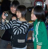 SAY CHEESE - A Japanese exchange student snapped a picture while friends looked on in Camden, Maine. The group of middle-schoolers from Hirakawa, Japan, visited Camden last year. (Martha White) Image of SAY CHEESE - A Japanese exchange student snapped a picture while friends looked on in Camden, Maine. The group of middle-schoolers from Hirakawa, Japan, visited Camden last year. (Martha White)