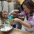 FAMILY FUN - Riley Wertheim and her mother, Sarah Wertheim of Norwich, Vt., measure out ingredients for pizza dough at a cooking class for kids at King Arthur Flour in Norwich. (Larry Crowe) Image of FAMILY FUN - Riley Wertheim and her mother, Sarah Wertheim of Norwich, Vt., measure out ingredients for pizza dough at a cooking class for kids at King Arthur Flour in Norwich. (Larry Crowe)