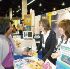 VBS PROPONENTS - Dione Grillo (left), director of children’s ministry at St. John Eudes in Chatsworth, chats March 2 with Susan Lawson (middle) and Melissa Kaiser (right), founders of “Growing with the Saints” Catholic Vacation-Bible School programs at the recent Religious Education Congress in Anaheim. (Paula Doyle) Image of VBS PROPONENTS - Dione Grillo (left), director of children’s ministry at St. John Eudes in Chatsworth, chats March 2 with Susan Lawson (middle) and Melissa Kaiser (right), founders of “Growing with the Saints” Catholic Vacation-Bible School programs at the recent Religious Education Congress in Anaheim. (Paula Doyle)