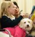 TAIL-WAGGING FUN - Katelynn Ploof reads Dr. Seuss’ “Mr. Brown Can Moo! Can You?” to Miss Maizie the dog, her fourth-grade classmates and her teacher Brenda Pahl at Walbridge St. Jerome School. (Chronicle/Laurie Stevens) Image of TAIL-WAGGING FUN - Katelynn Ploof reads Dr. Seuss’ “Mr. Brown Can Moo! Can You?” to Miss Maizie the dog, her fourth-grade classmates and her teacher Brenda Pahl at Walbridge St. Jerome School. (Chronicle/Laurie Stevens)