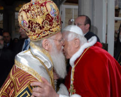 The Holy Father greets Chaldean Archbishop Rahho, while first Chaldean Cardinal, Patriarch Mar Emanuel III Delli, looks on. Archbishop Rahho would shortly thereafter be martyred for the ancient Catholic Christian faith. Image of The Holy Father greets Chaldean Archbishop Rahho, while first Chaldean Cardinal, Patriarch Mar Emanuel III Delli, looks on. Archbishop Rahho would shortly thereafter be martyred for the ancient Catholic Christian faith.