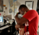 Adell Hendon hugs his son Noah, 4 months-old, on Tuesday, June 3, 2008, in Parkville, Missouri. Hendon has chosen to work from home so that he can be with Noah as much as possible. (Shane Keyser/Kansas City Star/MCT) Image of Adell Hendon hugs his son Noah, 4 months-old, on Tuesday, June 3, 2008, in Parkville, Missouri. Hendon has chosen to work from home so that he can be with Noah as much as possible. (Shane Keyser/Kansas City Star/MCT)