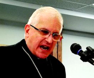 The Bishop stepped up to the microphone. He told those present: “No social issue has caused the death of 50 million people”, referring of course to the current evil of abortion on demand as it exists in the United States of America since the horrible judicial opinions in Roe and Doe. Then he spoke those four words, “This is Madness People.” Image of The Bishop stepped up to the microphone. He told those present: “No social issue has caused the death of 50 million people”, referring of course to the current evil of abortion on demand as it exists in the United States of America since the horrible judicial opinions in Roe and Doe. Then he spoke those four words, “This is Madness People.”