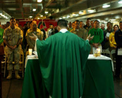 Often, for many of our military who died in action, a chaplain was final person in charge of their soul. In harm’s way, these faithful servants of Christ’s Church don’t just stand beside the men and women in various branches of the service, they wear the uniform.The work of our chaplains extends much farther that the post chapel. They labor on land, at sea and in the air. There are 1.4 million Catholics in the military; wherever they are stationed, the chaplain is there. Image of Often, for many of our military who died in action, a chaplain was final person in charge of their soul. In harm’s way, these faithful servants of Christ’s Church don’t just stand beside the men and women in various branches of the service, they wear the uniform.The work of our chaplains extends much farther that the post chapel. They labor on land, at sea and in the air. There are 1.4 million Catholics in the military; wherever they are stationed, the chaplain is there.