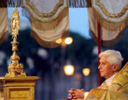 After having received the Body, Blood, Soul and Divinity of Jesus Christ in Holy Communion, Catholic Christians proceed from the Sanctuary into the Streets of the world, pausing along the way for solemn worship, songs of adoration, and holding the Lord aloft, enthroned. The procession symbolizes the ongoing redemptive mission of Jesus Christ to the world as it is now lived out through his Church. Image of After having received the Body, Blood, Soul and Divinity of Jesus Christ in Holy Communion, Catholic Christians proceed from the Sanctuary into the Streets of the world, pausing along the way for solemn worship, songs of adoration, and holding the Lord aloft, enthroned. The procession symbolizes the ongoing redemptive mission of Jesus Christ to the world as it is now lived out through his Church.