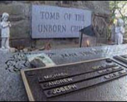 Soon the Color Guard was back in line. The Order of the Mass was beginning. They marched toward the makeshift altar with their backs to the thick slab of polished black granite that stood upright, a little taller than a five year old, behind the last row of lawn chairs. 'In loving memory of God's aborted unborn children,' the inscription read. Image of Soon the Color Guard was back in line. The Order of the Mass was beginning. They marched toward the makeshift altar with their backs to the thick slab of polished black granite that stood upright, a little taller than a five year old, behind the last row of lawn chairs. 'In loving memory of God's aborted unborn children,' the inscription read.
