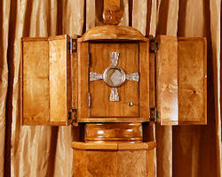 Two billboards featuring the Eucharist displayed in a monstrance tower over the streets in Brighton and East Boston. The words under the image read, 'The Son’s rays for your soul.' Image of Two billboards featuring the Eucharist displayed in a monstrance tower over the streets in Brighton and East Boston. The words under the image read, 'The Son’s rays for your soul.'