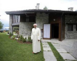 On one of several walks he takes daily during his vacation, the Holy Father continues his pastoral work. Image of On one of several walks he takes daily during his vacation, the Holy Father continues his pastoral work.