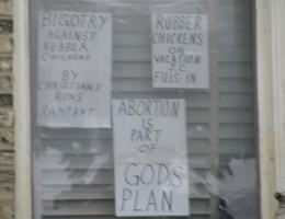 You will see the intentional placement of a rubber chicken over the Corpus of Jesus Christ which is hung on the Cross. This is publicly displayed in the windows of this facility. This and other displays like it are absolute acts of blasphemy against God. They are also hate speech directed against Christians. Image of You will see the intentional placement of a rubber chicken over the Corpus of Jesus Christ which is hung on the Cross. This is publicly displayed in the windows of this facility. This and other displays like it are absolute acts of blasphemy against God. They are also hate speech directed against Christians.