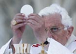 Pope Benedict XVI elevates the consecrated host during the divine liturgy. Image of Pope Benedict XVI elevates the consecrated host during the divine liturgy.