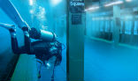 A diver plumbs the depths of a flooded subway station. Image of A diver plumbs the depths of a flooded subway station.