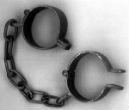 Real chains are unnecessary in the modern era as slaves are bound by cultural stigma and fear. Image of Real chains are unnecessary in the modern era as slaves are bound by cultural stigma and fear.