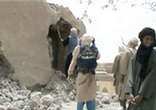 A cellphone captures the image of an Islamist fighter during the destruction of Timbuktu's treasures. Image of A cellphone captures the image of an Islamist fighter during the destruction of Timbuktu's treasures.