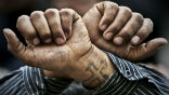 Egyptian Copts wear tattoos such as this cross, which Libyans are using as evidence of guilt. Image of Egyptian Copts wear tattoos such as this cross, which Libyans are using as evidence of guilt.
