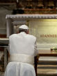 Pope Francis praying at the tomb of Pope John Paul II. Image of Pope Francis praying at the tomb of Pope John Paul II.