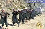 Trained to fight and die, children fire their AK-47s on command. Image of Trained to fight and die, children fire their AK-47s on command.
