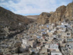 Built against the side of a mountain, Maaloula is an ancient Christian enclave where the inhabitants still speak Aramaic, the language of Christ. Image of Built against the side of a mountain, Maaloula is an ancient Christian enclave where the inhabitants still speak Aramaic, the language of Christ.