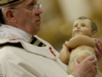 Pope Francis carried the heavy statue of infant Jesus himself, no retinue required. Image of Pope Francis carried the heavy statue of infant Jesus himself, no retinue required.