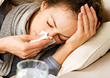 Influenza, or flu, is a respiratory illness that is caused by a virus. Flu is highly contagious and is usually spread by the coughs and sneezes of a person who is infected. Image of Influenza, or flu, is a respiratory illness that is caused by a virus. Flu is highly contagious and is usually spread by the coughs and sneezes of a person who is infected.