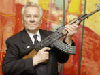 Kalashnikov with his iconic rifle. Image of Kalashnikov with his iconic rifle.